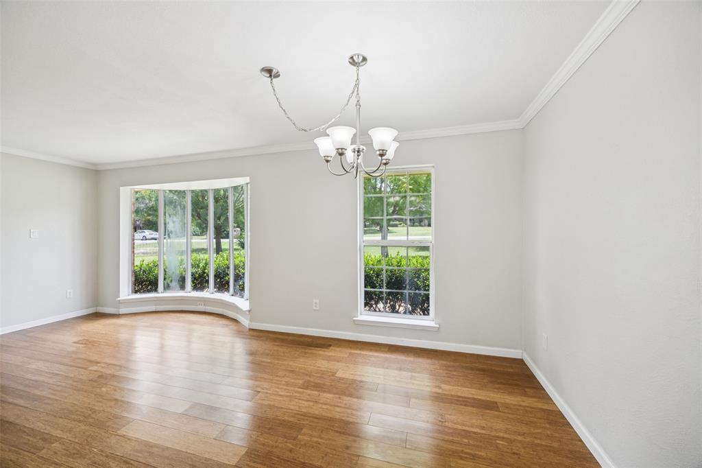 1 Glen Cove Circle Lucas, TX 75002 - Photo 13 of 37 a view of a room with window wooden floor and chandelier