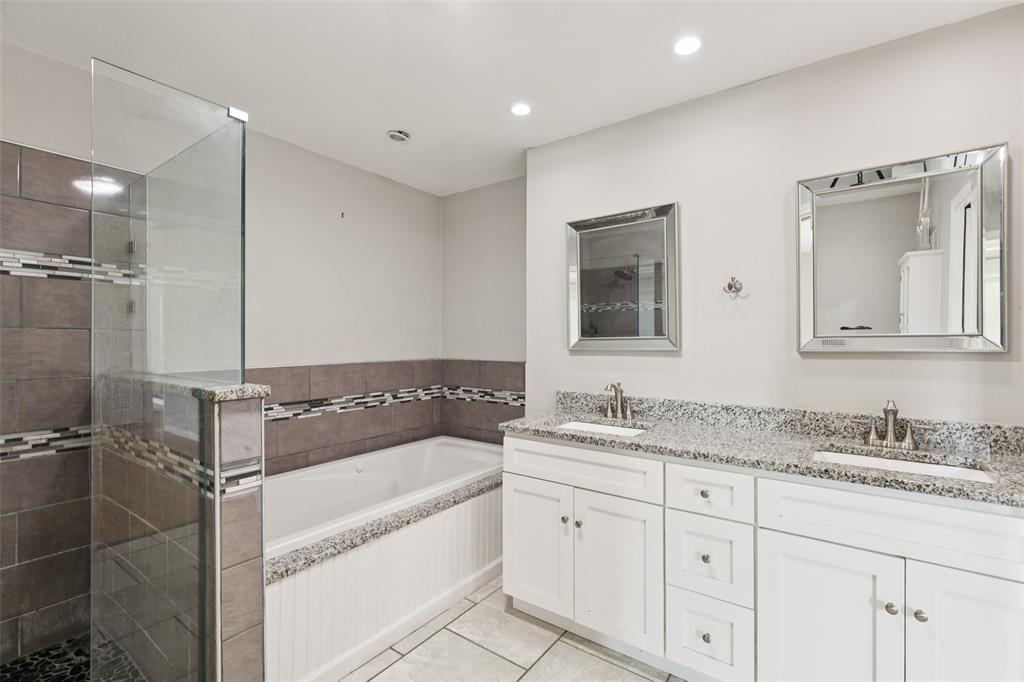 1 Glen Cove Circle Lucas, TX 75002 - Photo 16 of 37 a bathroom with a tub sink and mirror