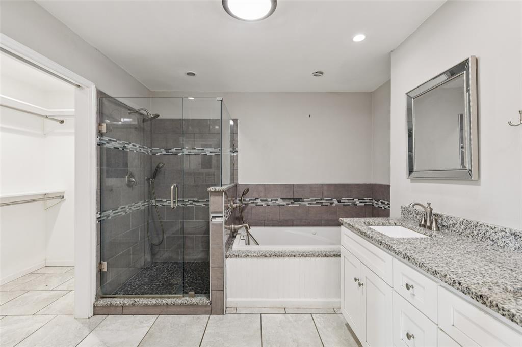 1 Glen Cove Circle Lucas, TX 75002 - Photo 17 of 37 a bathroom with a granite countertop sink a mirror and a shower