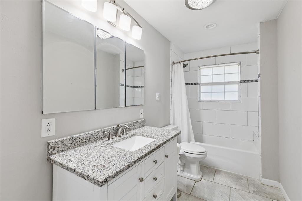 1 Glen Cove Circle Lucas, TX 75002 - Photo 18 of 37 a bathroom with a granite countertop sink a toilet and shower
