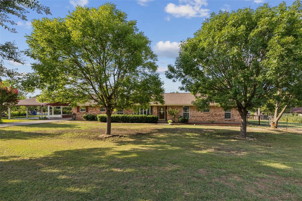 1 Glen Cove Circle Lucas, TX 75002 - Photo 2 of 37 a big yard with large trees and a small yard