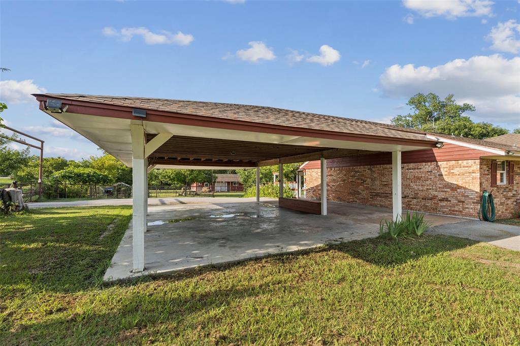 1 Glen Cove Circle Lucas, TX 75002 - Photo 26 of 37 a view of a patio with a table and chairs under an umbrella