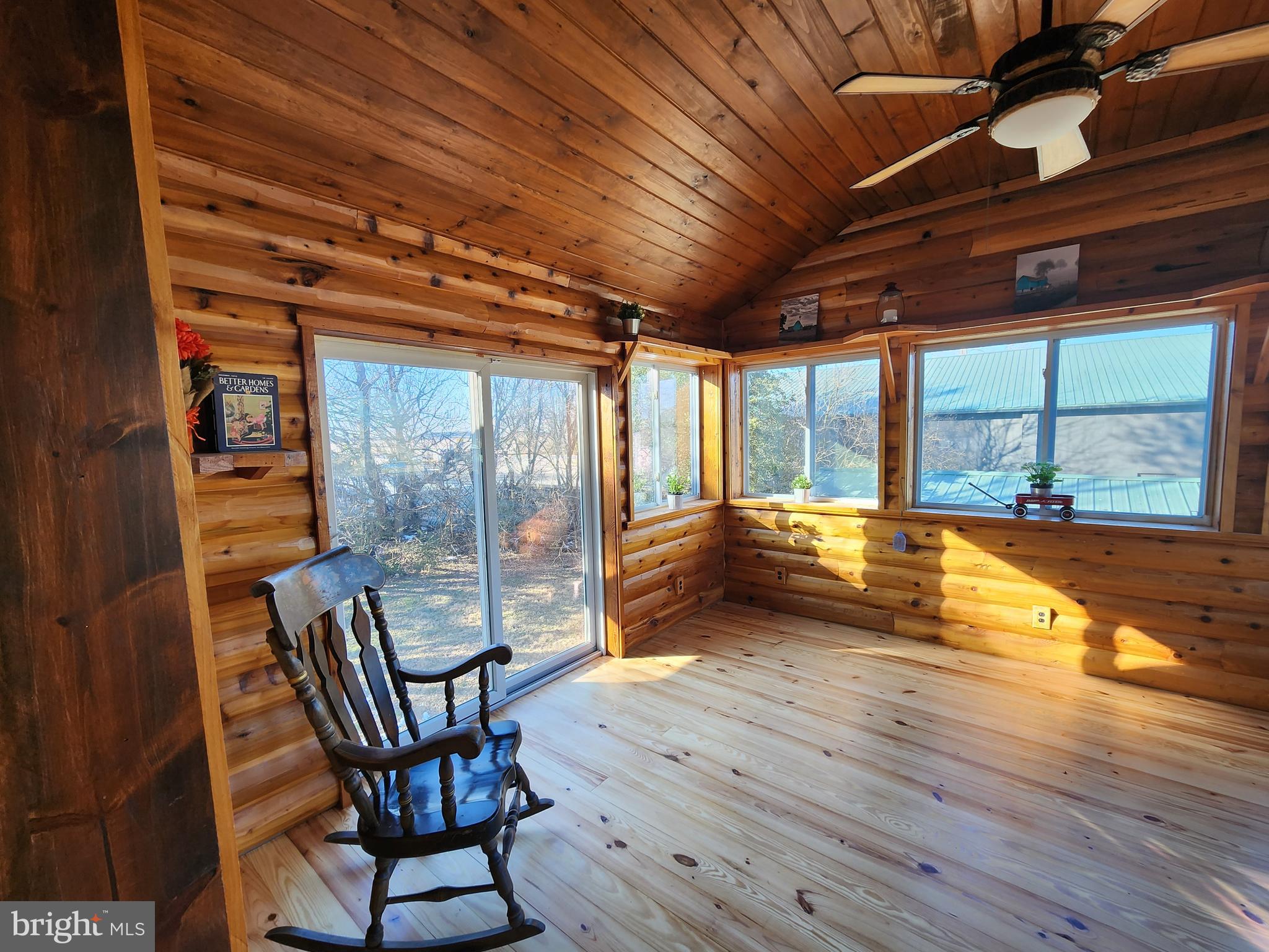 6366 Galestown-Reliance Road Federalsburg, MD 21632 - Photo 19 of 55 a view of a room with wooden floor and iron stairs