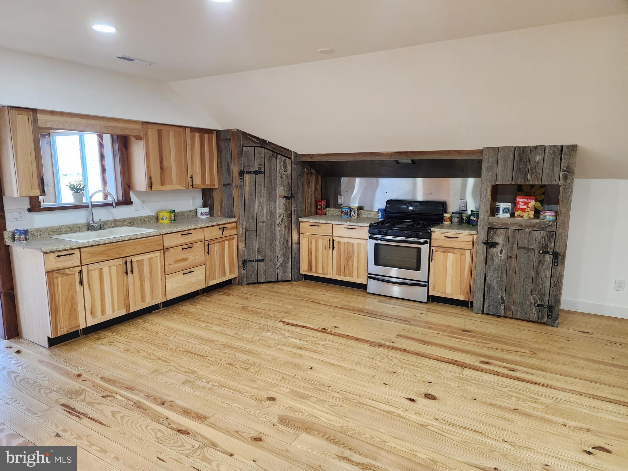 6366 Galestown-Reliance Road Federalsburg, MD 21632 - Photo 2 of 55 a kitchen with stainless steel appliances granite countertop a stove top oven and sink