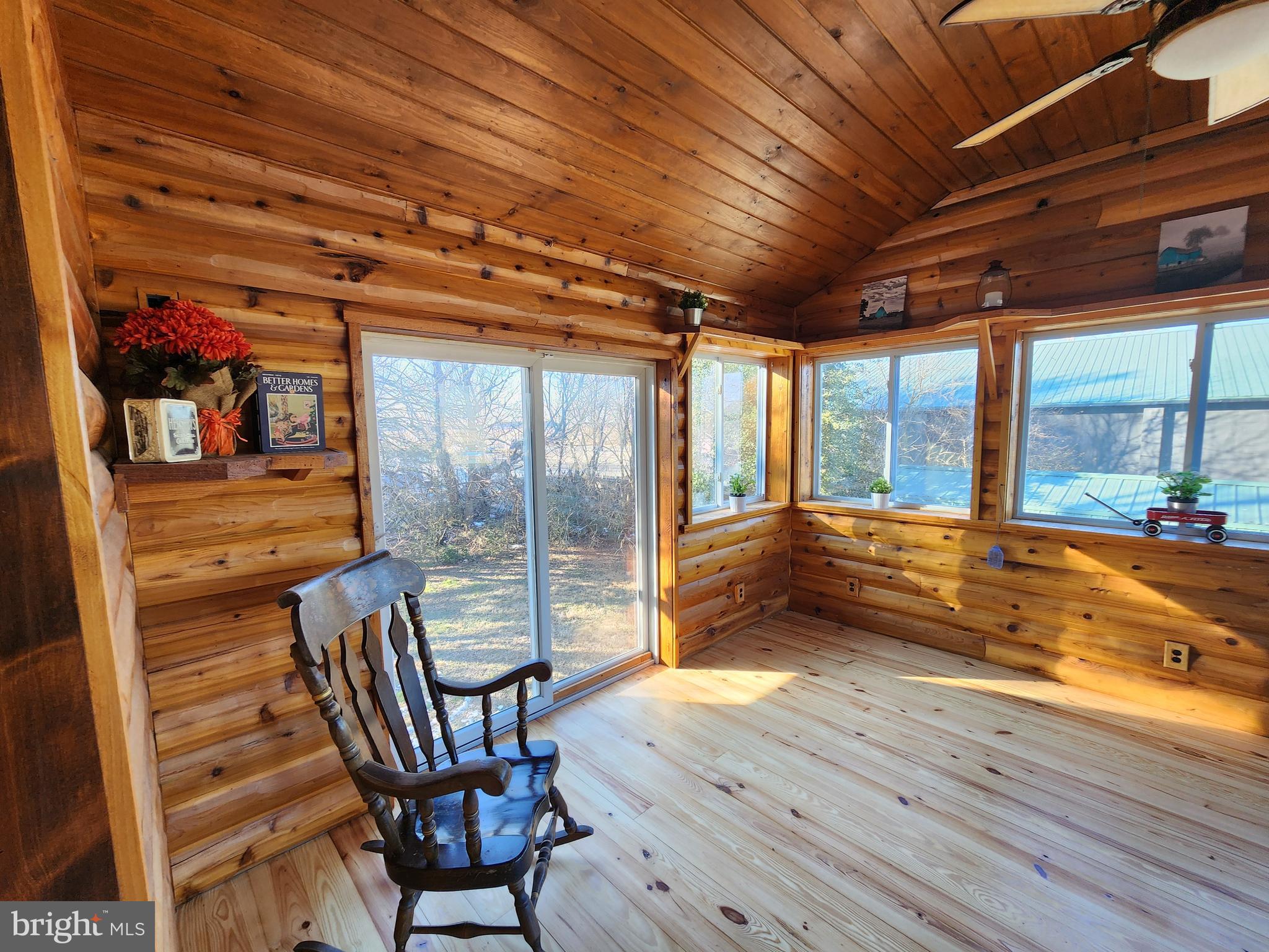 6366 Galestown-Reliance Road Federalsburg, MD 21632 - Photo 30 of 55 a view of a porch with furniture and a yard