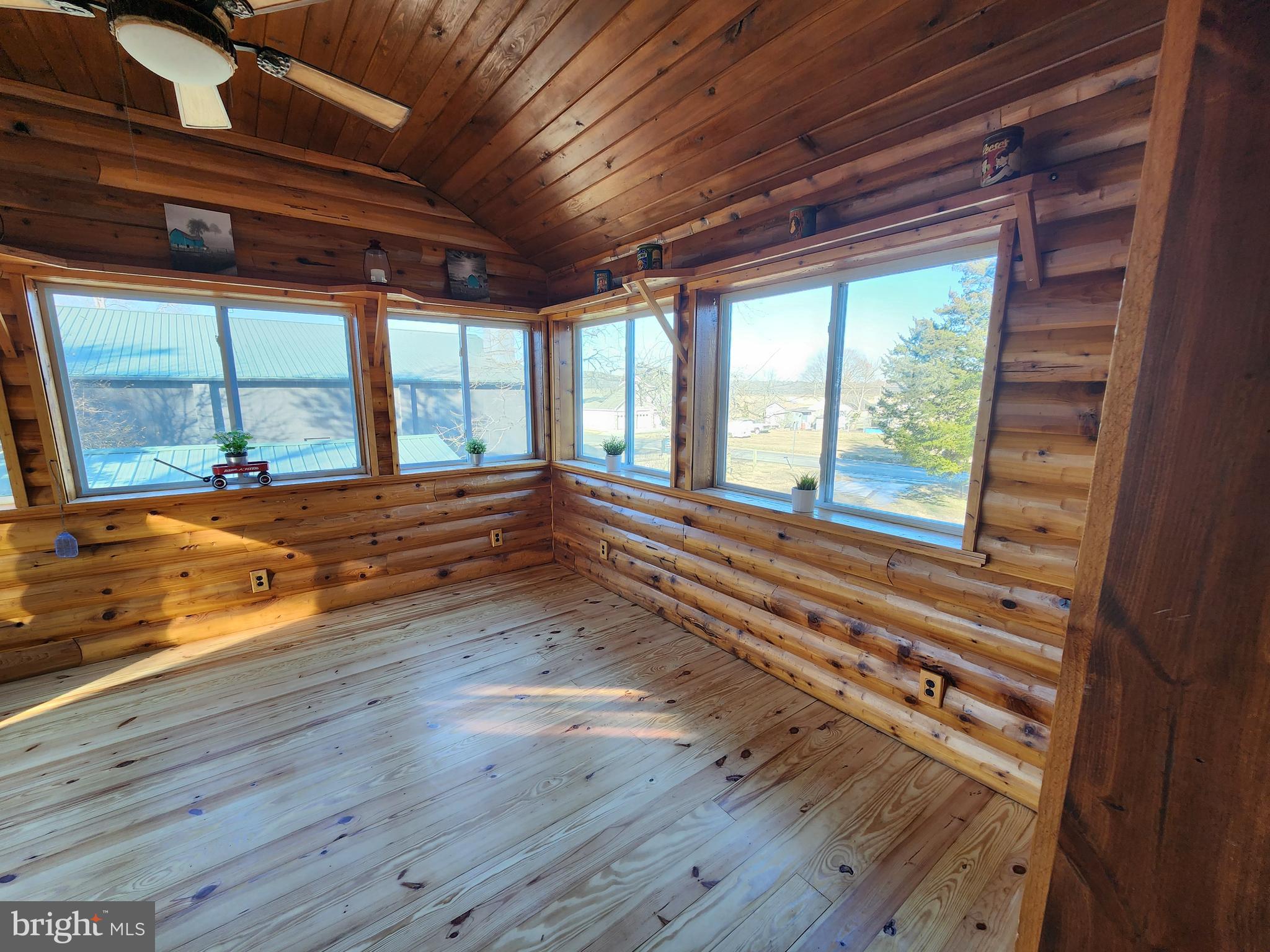 6366 Galestown-Reliance Road Federalsburg, MD 21632 - Photo 31 of 55 a view of an empty room with wooden floor and a window