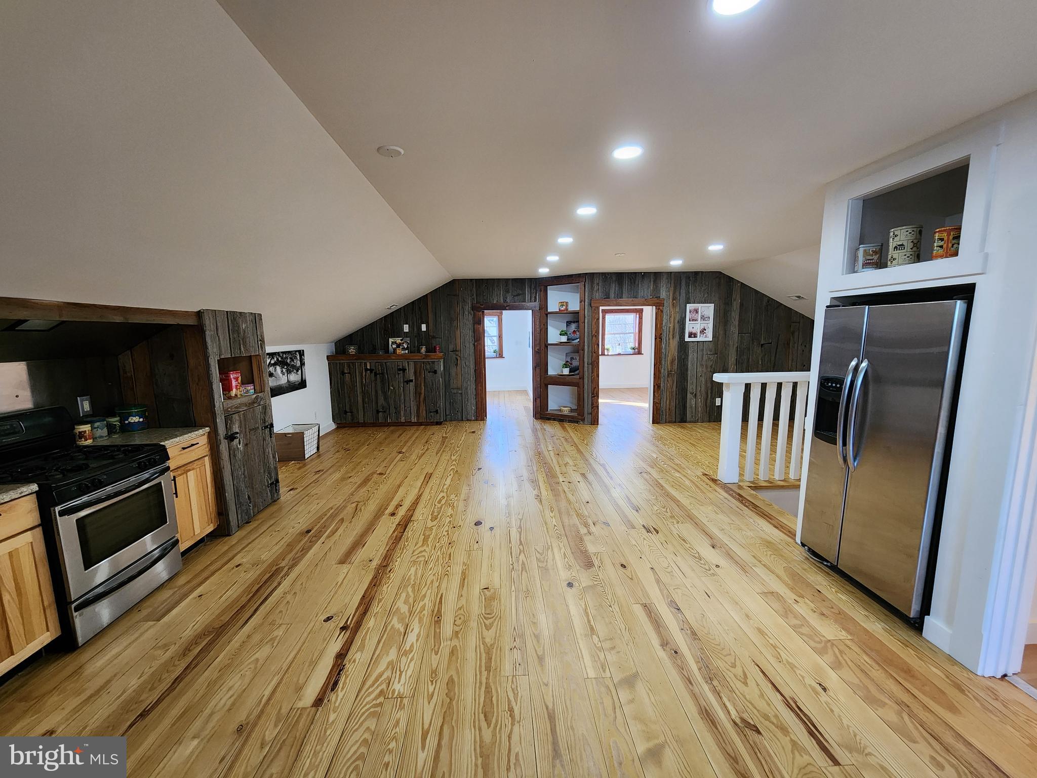 6366 Galestown-Reliance Road Federalsburg, MD 21632 - Photo 35 of 55 a view of a living room hardwood floor and a kitchen