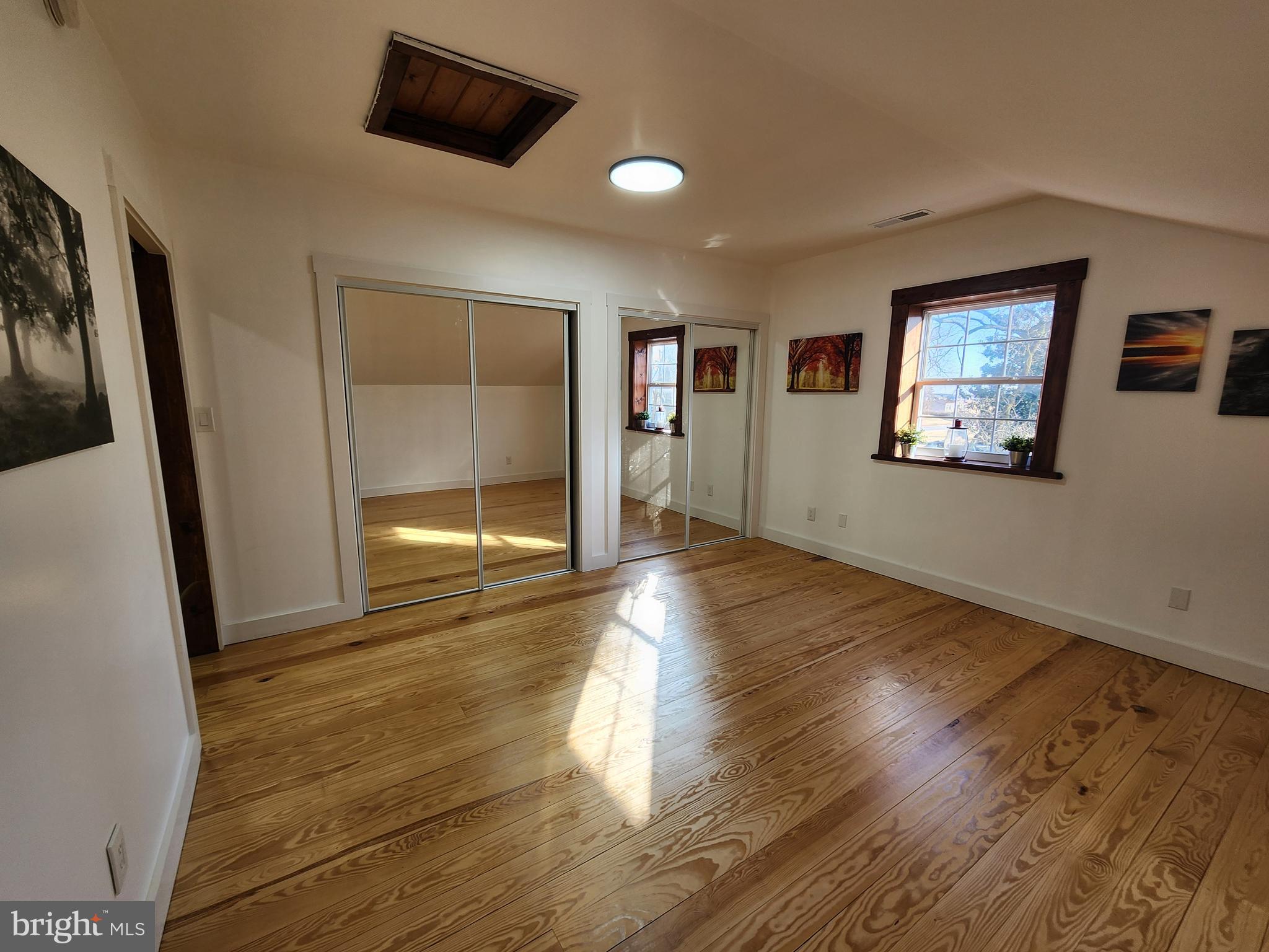6366 Galestown-Reliance Road Federalsburg, MD 21632 - Photo 40 of 55 wooden floor in an empty room with a window