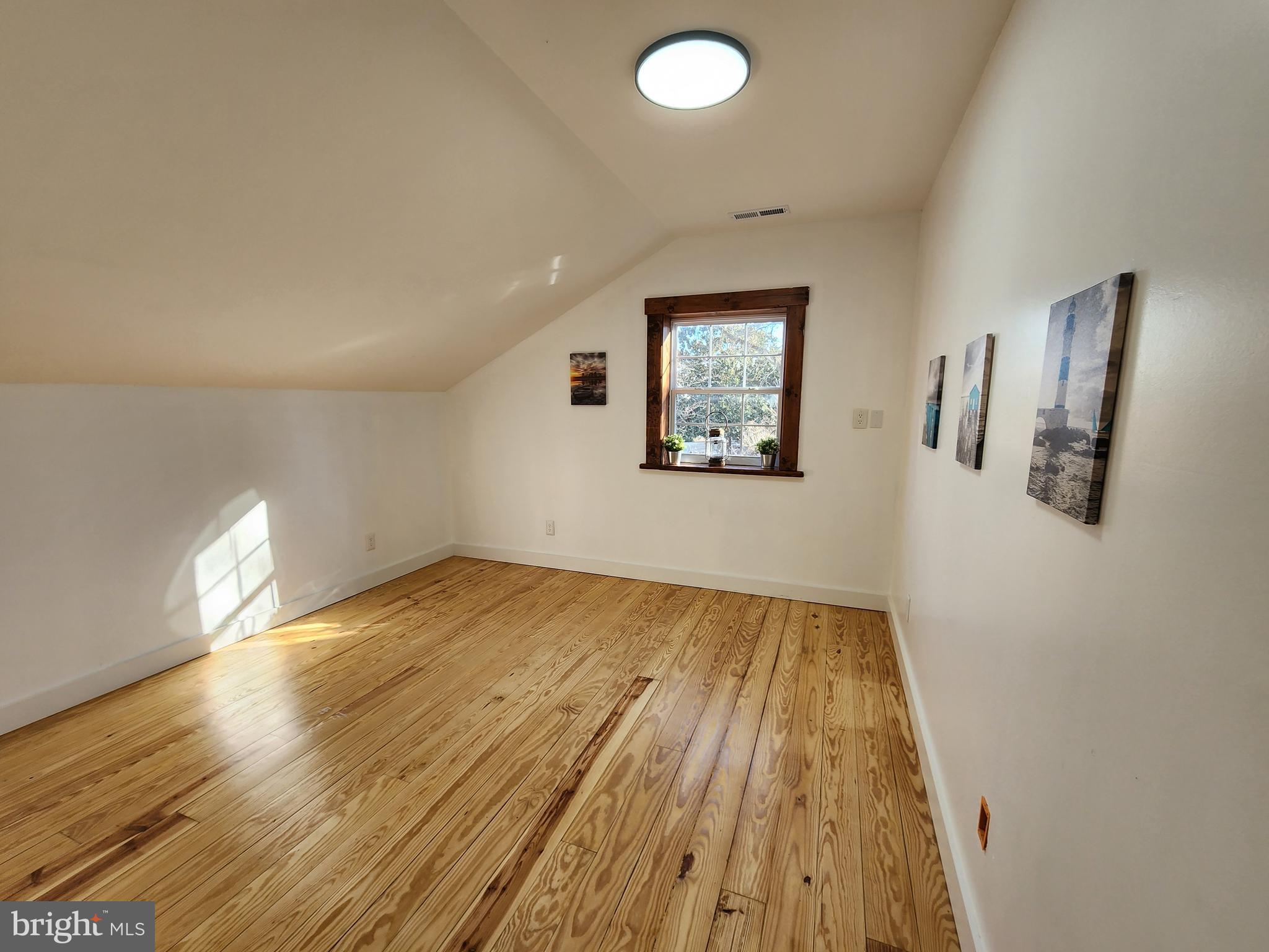 6366 Galestown-Reliance Road Federalsburg, MD 21632 - Photo 43 of 55 a view of empty room with wooden floor