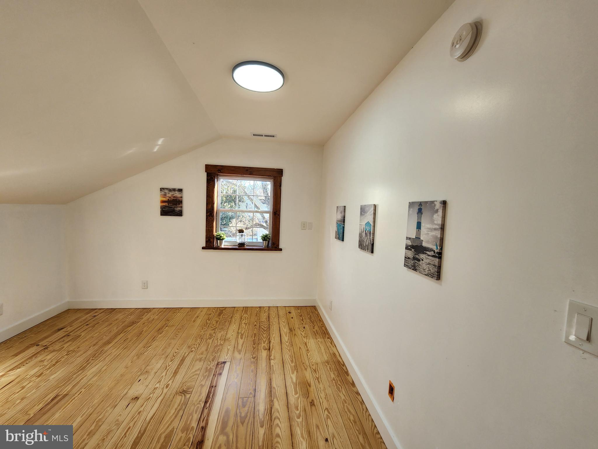 6366 Galestown-Reliance Road Federalsburg, MD 21632 - Photo 44 of 55 a view of a hallway with wooden floor
