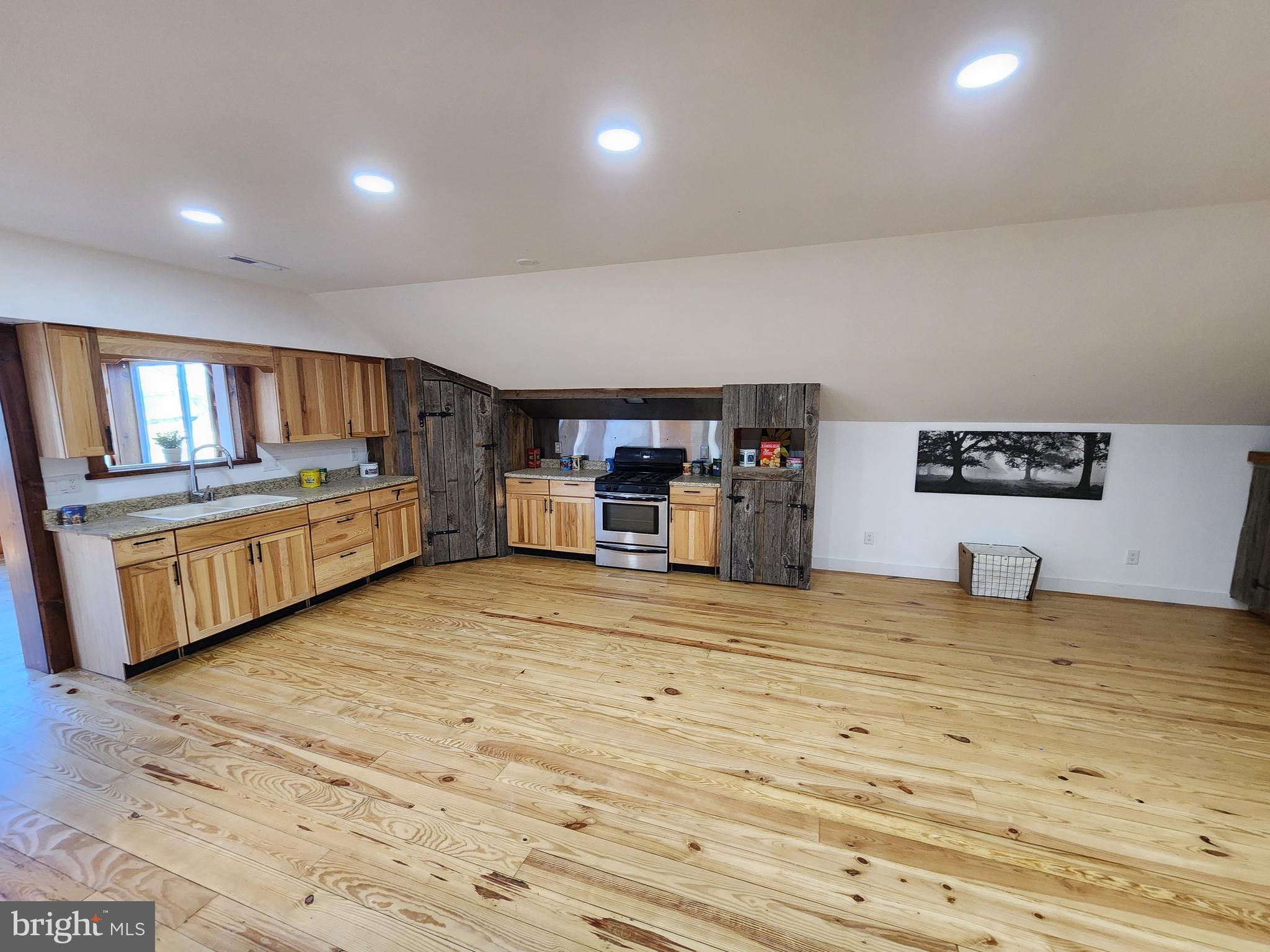 6366 Galestown-Reliance Road Federalsburg, MD 21632 - Photo 47 of 55 a living room with furniture and a flat screen tv