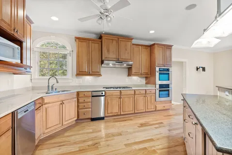 a view of a kitchen with a sink and a window