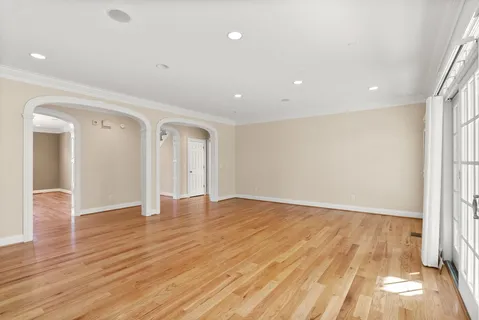 a kitchen with stainless steel appliances kitchen island granite countertop a stove a sink and a refrigerator