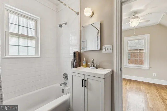 a bathroom with a sink a bathtub and a shower