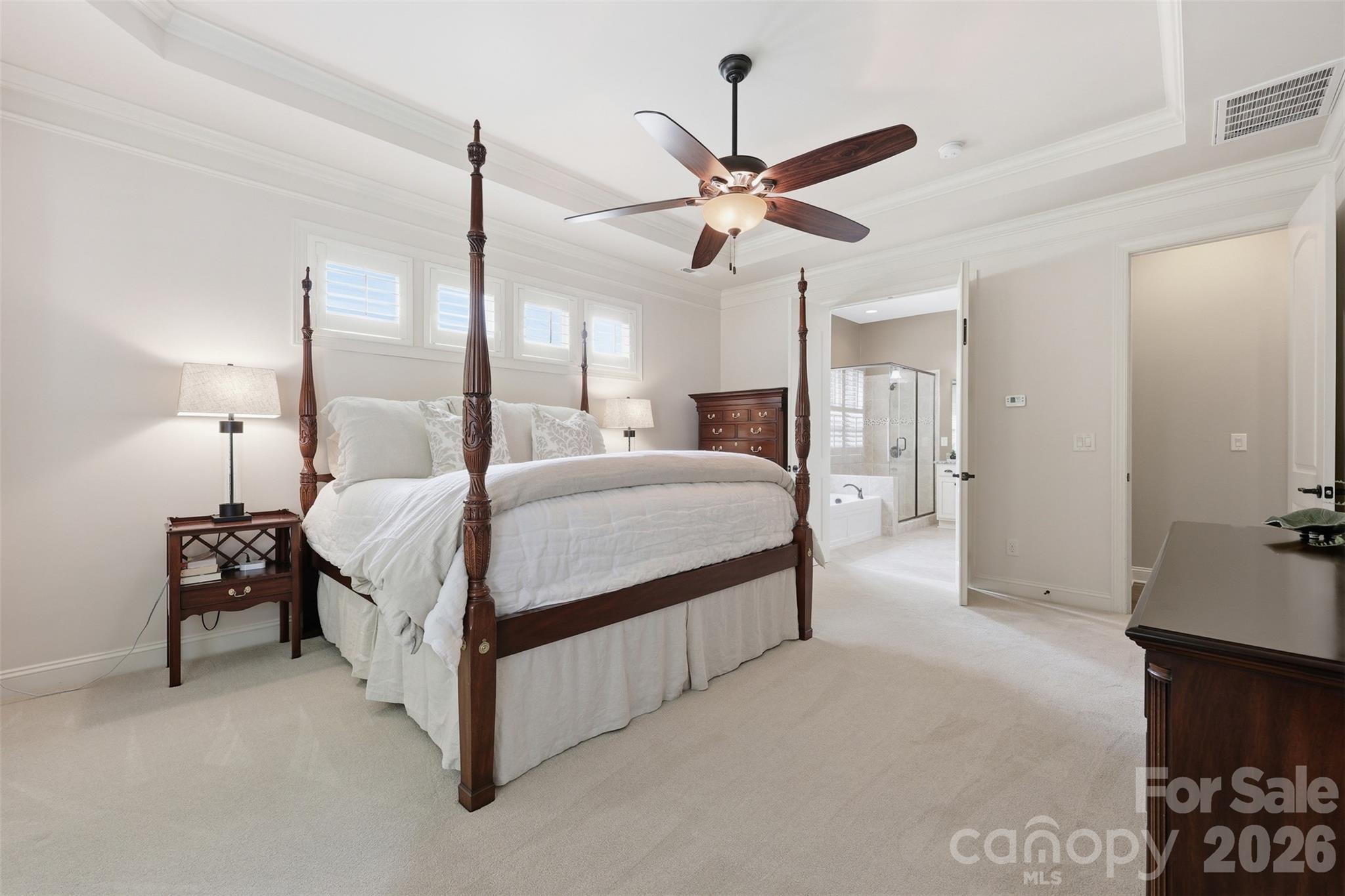 8094 Clems Branch Road Indian Land, SC 29707 - Photo 7 of 38 a bedroom with a bed a chandelier and dresser