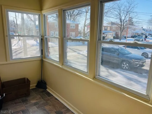 a view of a door and a window of the house