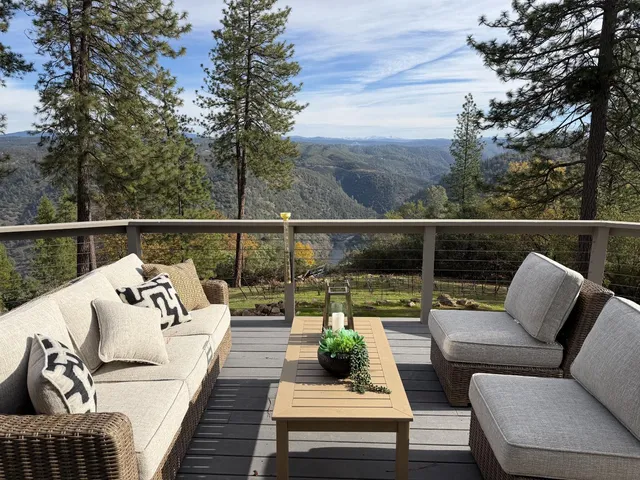 view of balcony with seating space and wooden floor
