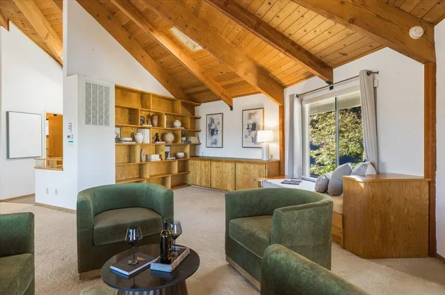 a view of a living room and dining room