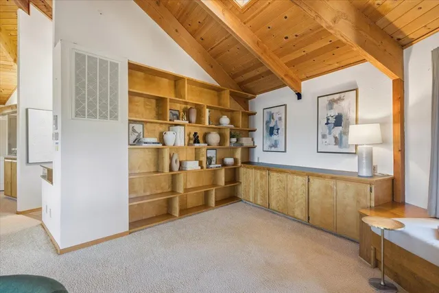 a view of a a dining room with furniture window and wooden floor