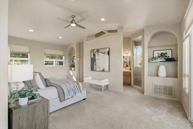 a spacious bathroom with a double vanity sink and a mirror