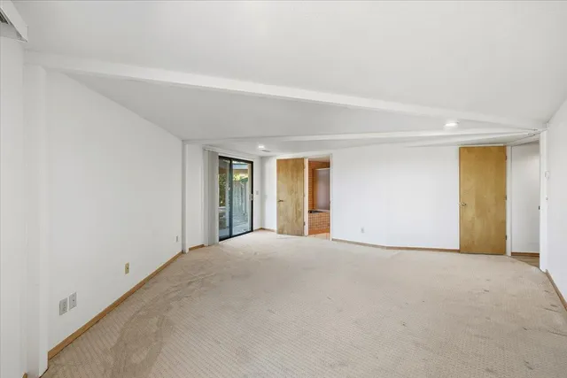 a view of a street with houses on the roadside