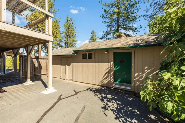 a view of a house with large trees