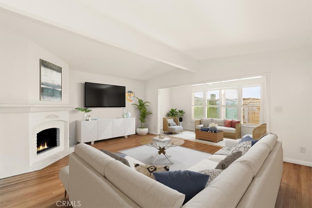 a living room with furniture fireplace and a flat screen tv