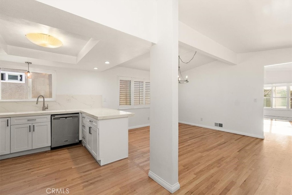 1742 Reed Street Redondo Beach, CA 90278 - Photo 19 of 33 a kitchen with a sink cabinets and wooden floor
