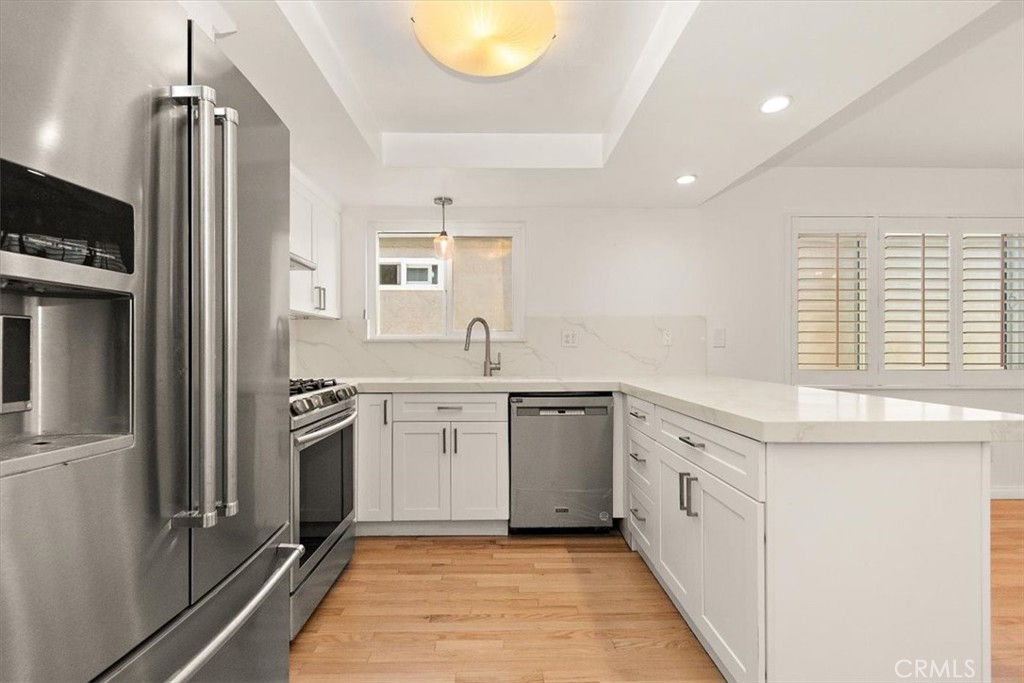 1742 Reed Street Redondo Beach, CA 90278 - Photo 2 of 33 a kitchen with granite countertop a sink stainless steel appliances and cabinets