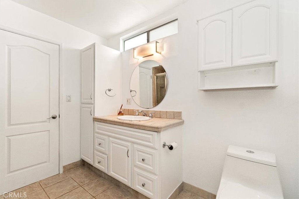 1742 Reed Street Redondo Beach, CA 90278 - Photo 23 of 33 a bathroom with a sink a toilet and a mirror