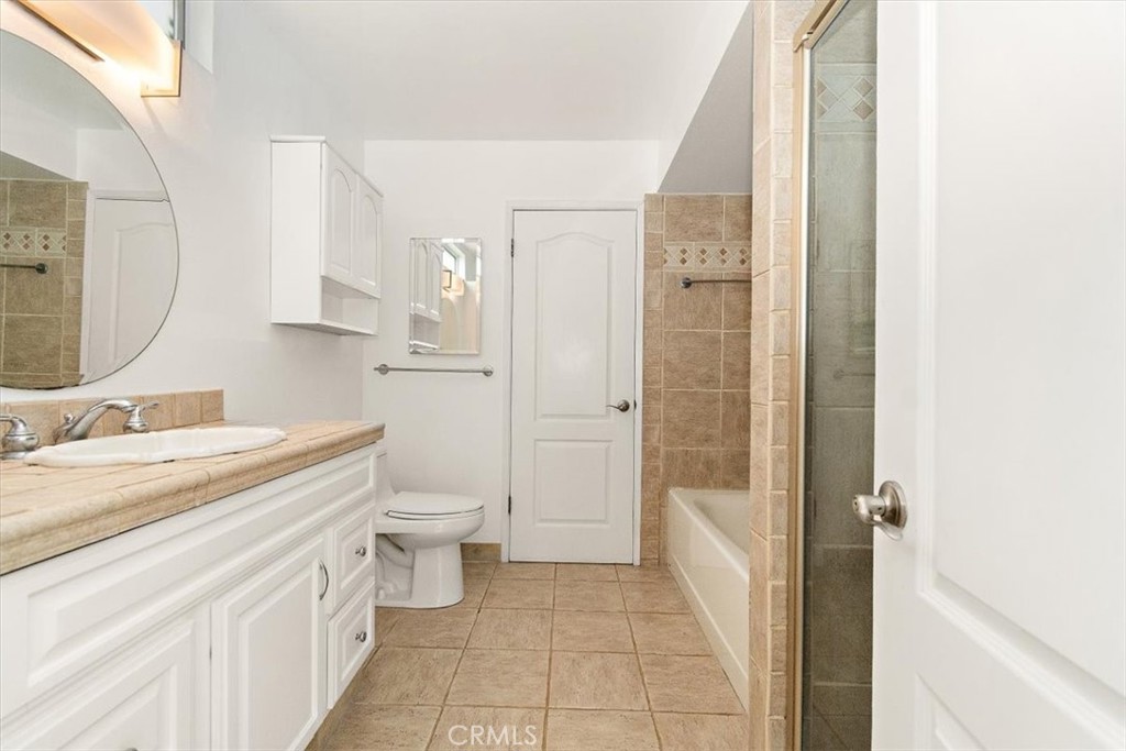 1742 Reed Street Redondo Beach, CA 90278 - Photo 25 of 33 a bathroom with a granite countertop sink toilet and shower