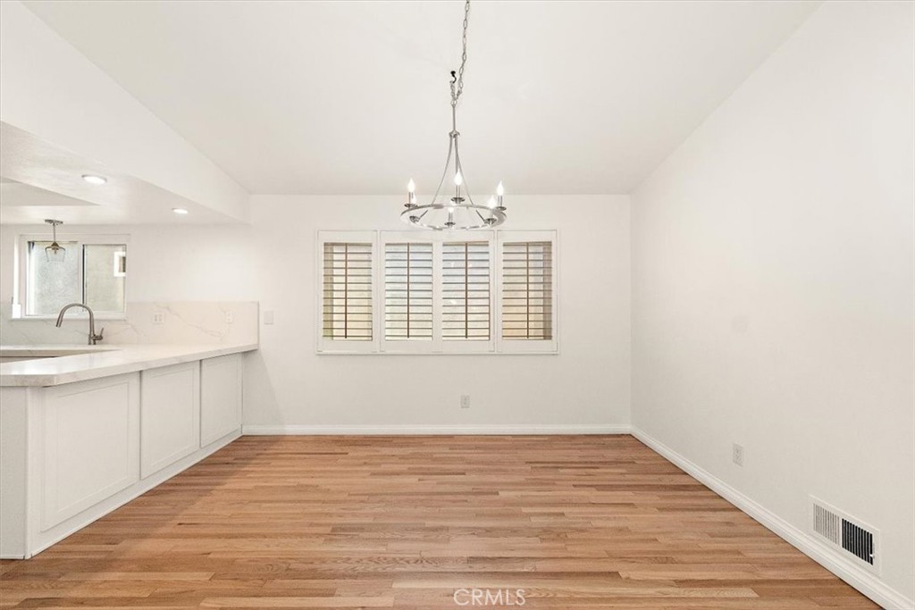 1742 Reed Street Redondo Beach, CA 90278 - Photo 29 of 33 a view of an empty room with window and wooden floor