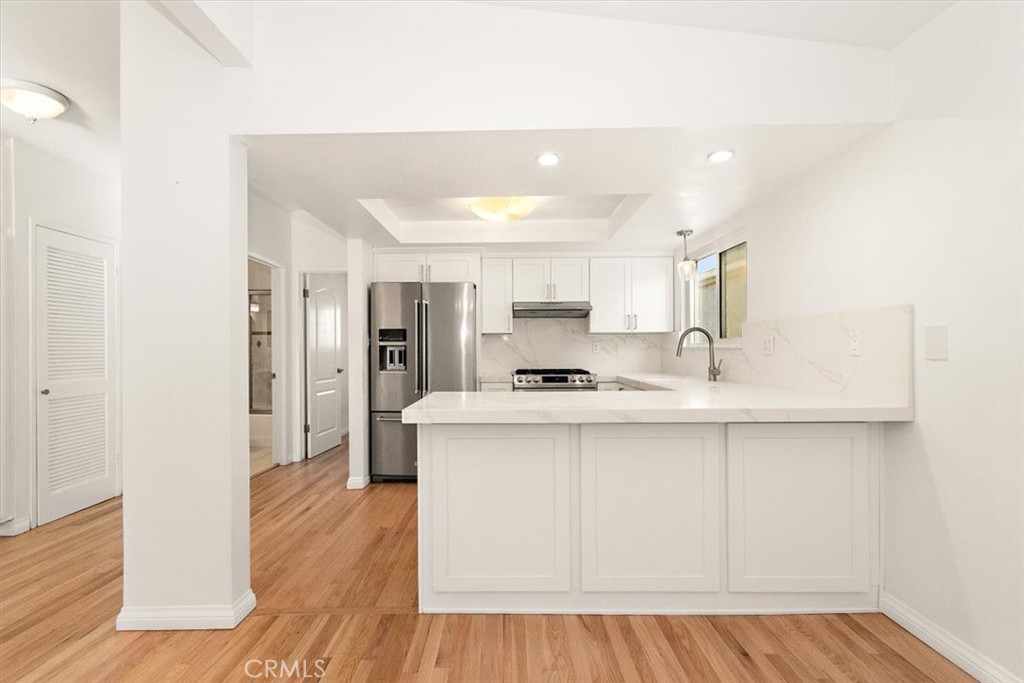 1742 Reed Street Redondo Beach, CA 90278 - Photo 5 of 33 a kitchen with stainless steel appliances a sink stove and refrigerator