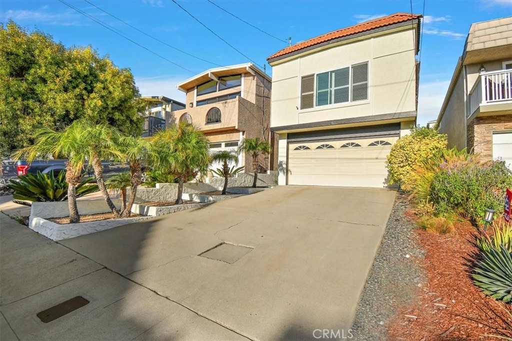 1742 Reed Street Redondo Beach, CA 90278 - Photo 9 of 33 a front view of a house with a yard