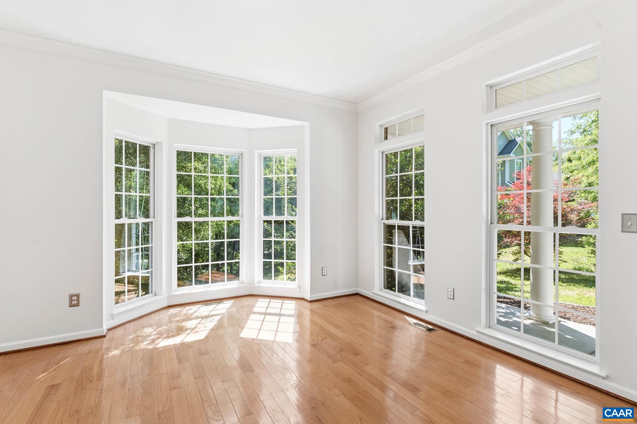 700 Rainier Road Charlottesville, VA 22903 - Photo 6 of 41 Bright front living space with hardwood floors and tall windows.