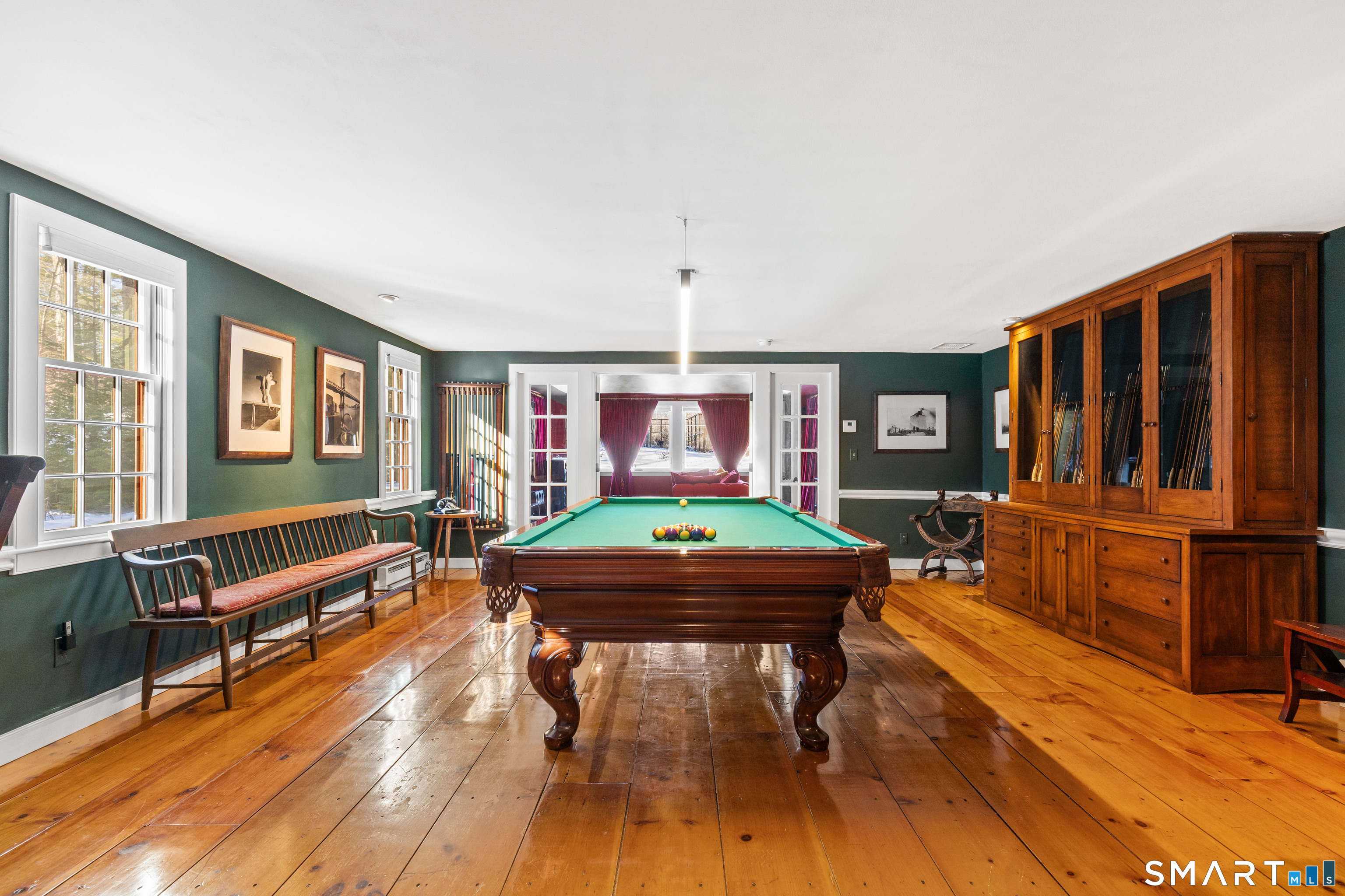 12 Jackson Road Killingworth, CT 06419 - Photo 15 of 40 The family room offers a fireplace and stylish dry bar creating a perfect setting for game nights and relaxed entertaining.