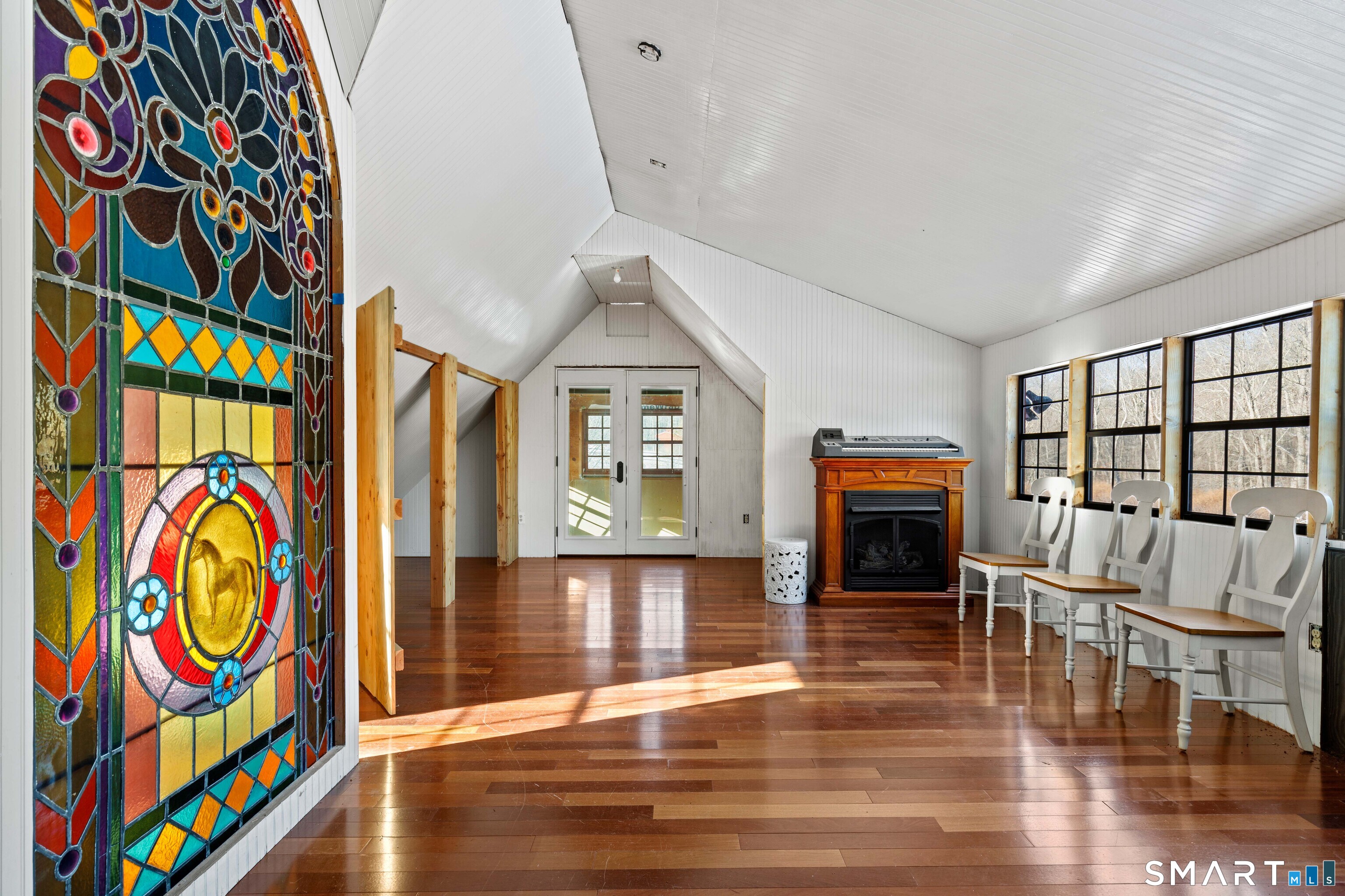 12 Jackson Road Killingworth, CT 06419 - Photo 31 of 40 Upstairs area of the studio featuring a gorgeous custom stained glass partition. Needs to be finished out.