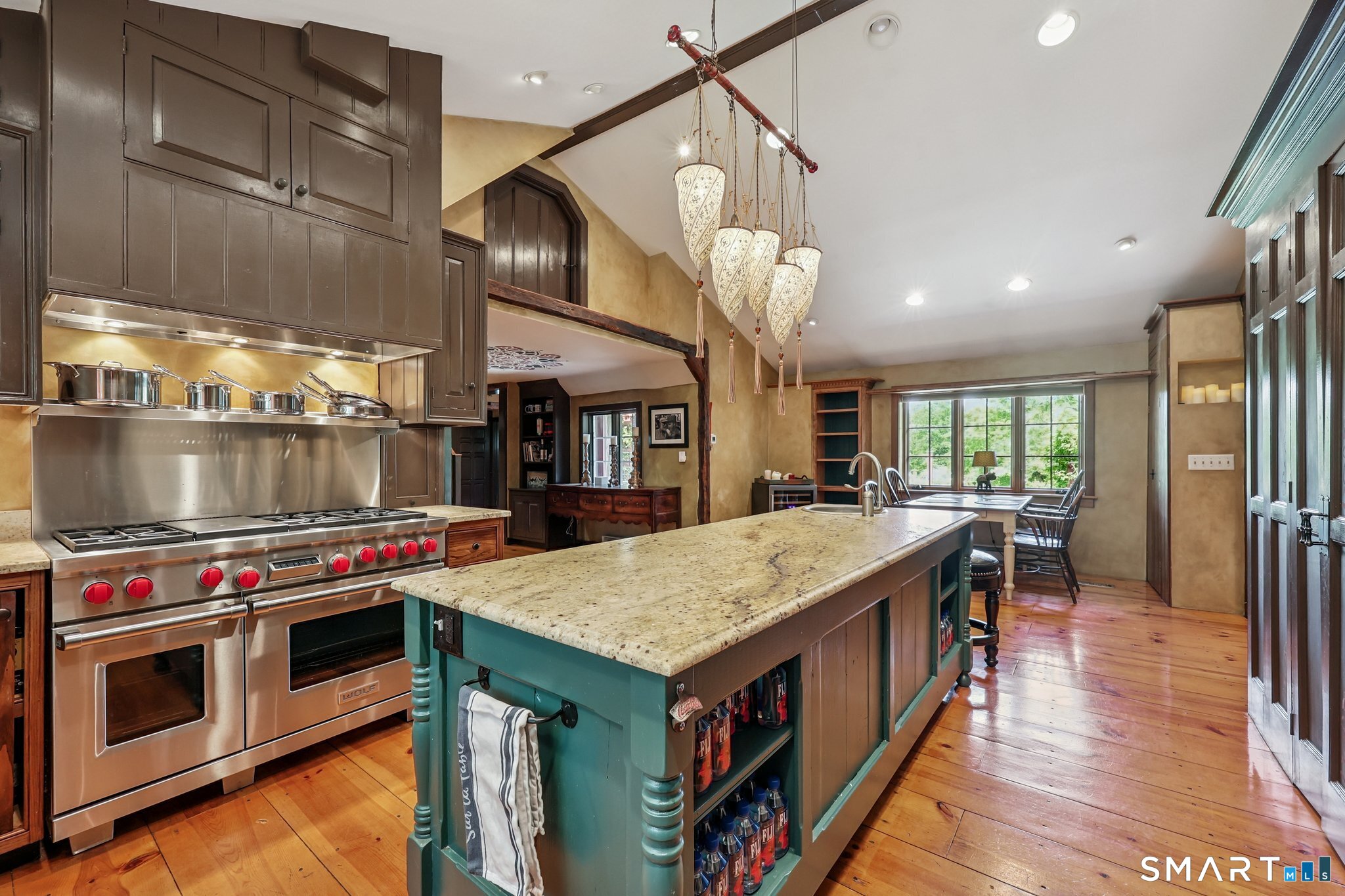 12 Jackson Road Killingworth, CT 06419 - Photo 5 of 40 The kitchen is the heart of the home offering wide plant white pine flooring, leathered granite counters, Wolf propane cooktop and grill, double ovens and a SubZero refrigerator.
