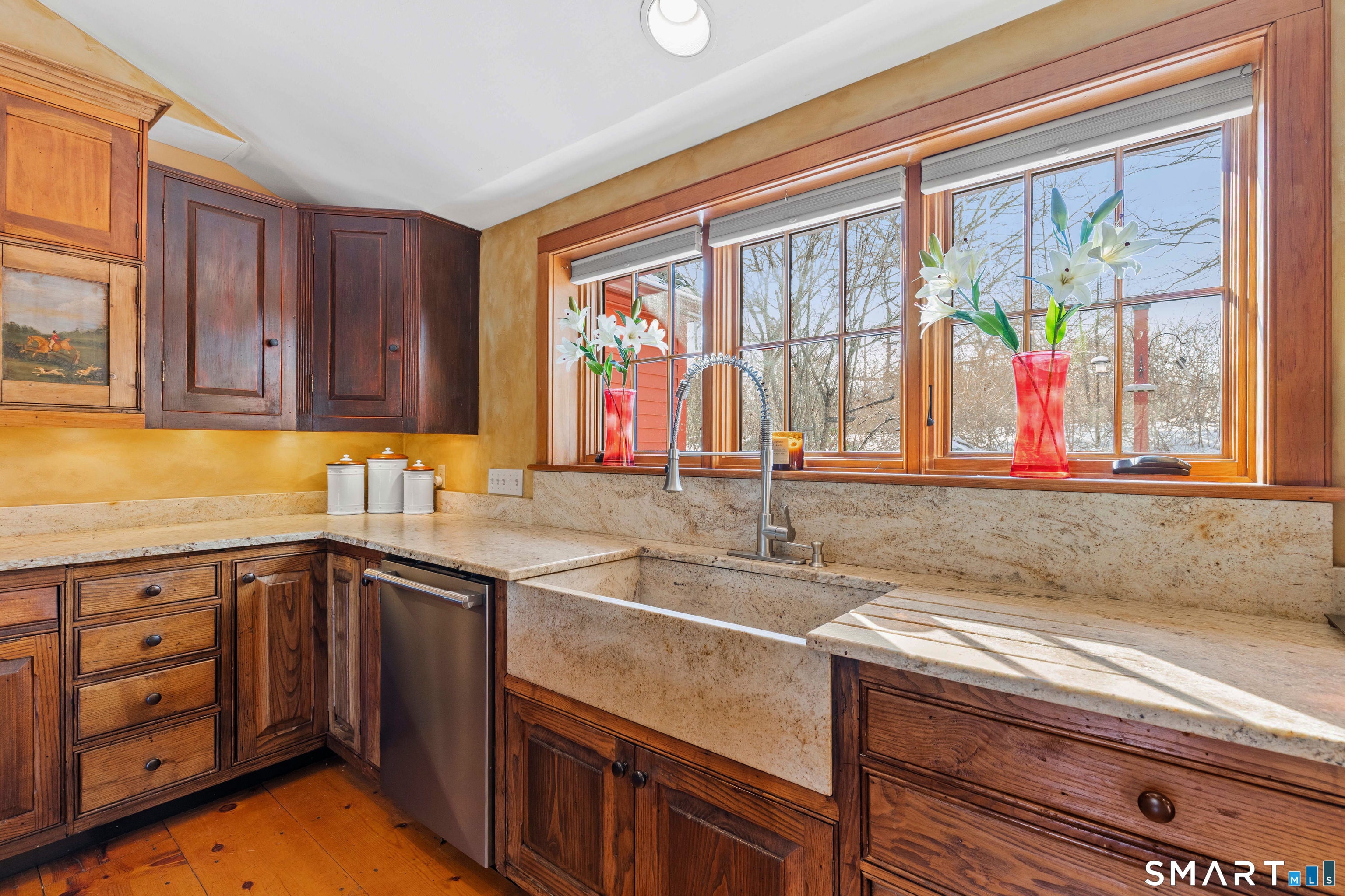 12 Jackson Road Killingworth, CT 06419 - Photo 9 of 40 Multiple large windows offer an abundance of natural light. Gorgeous farmhouse sink and custom cabinetry crafted by a skilled master carpenter.