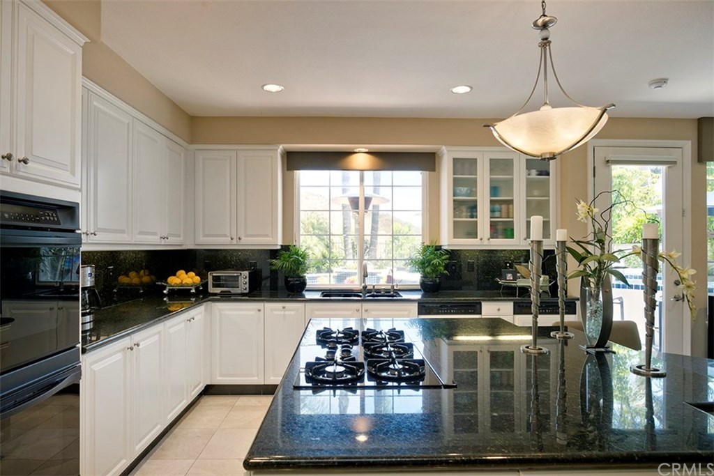 28362 Via Pasito San Juan Capistrano, CA 92675 - Photo 33 of 69 Kitchen has beautiful views of the back yard and ridgelines