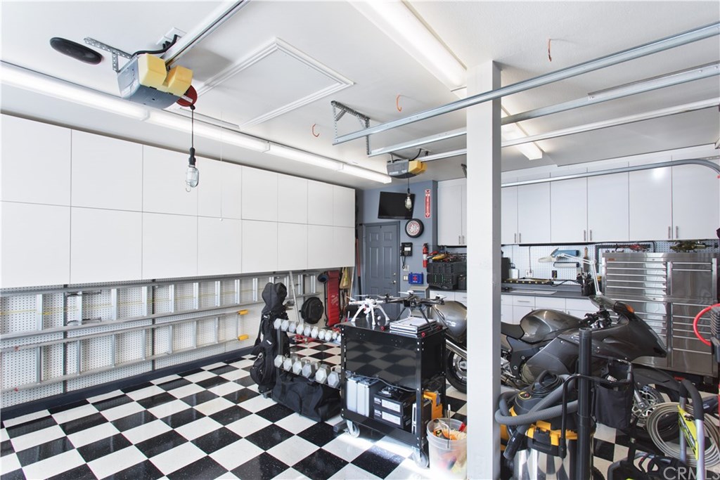 28362 Via Pasito San Juan Capistrano, CA 92675 - Photo 57 of 69 Garages 3 and 4 notice door to front courtyard, custom cabinetry