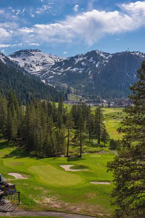 a bathroom with a granite countertop sink mirror vanity and toilet