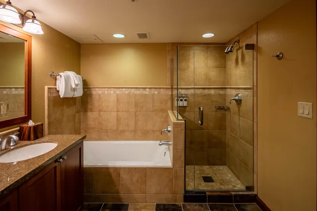 a bathroom with a shower and a sink