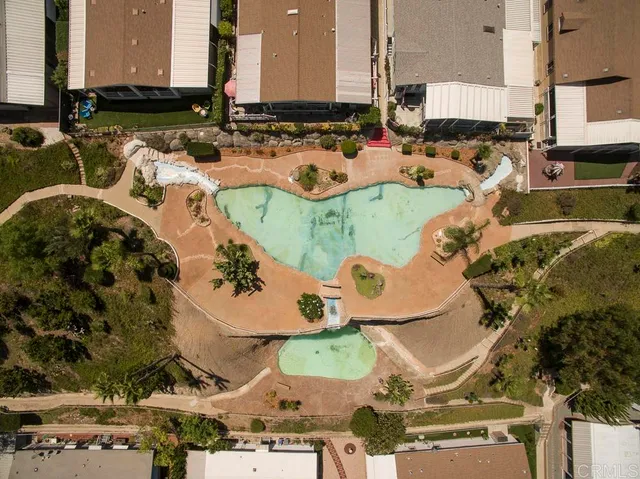 an aerial view of a house with swimming pool