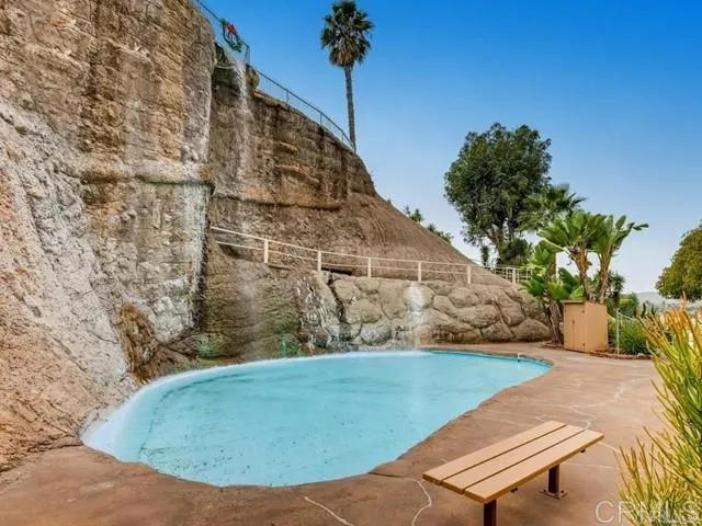a view of a backyard with a fountain