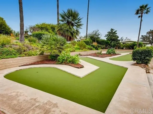 a view of a swimming pool with a yard