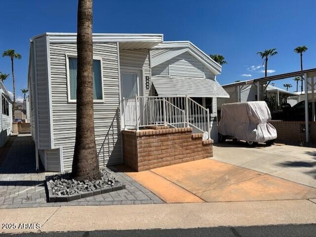 1444 South Zuni Drive Apache Junction, AZ 85119 - Photo 1 of 10 a front view of a house with windows