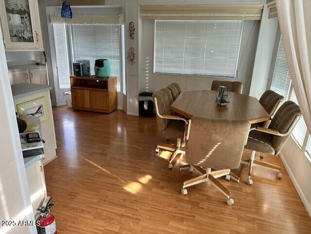 1444 South Zuni Drive Apache Junction, AZ 85119 - Photo 3 of 10 a view of a workspace with furniture and a window