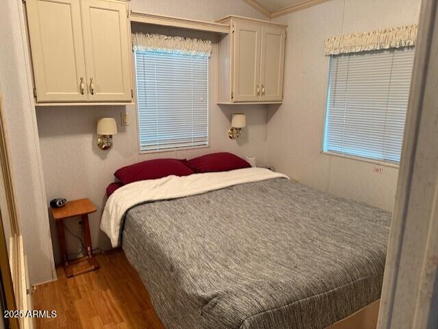 1444 South Zuni Drive Apache Junction, AZ 85119 - Photo 6 of 10 a bedroom with a bed and a window