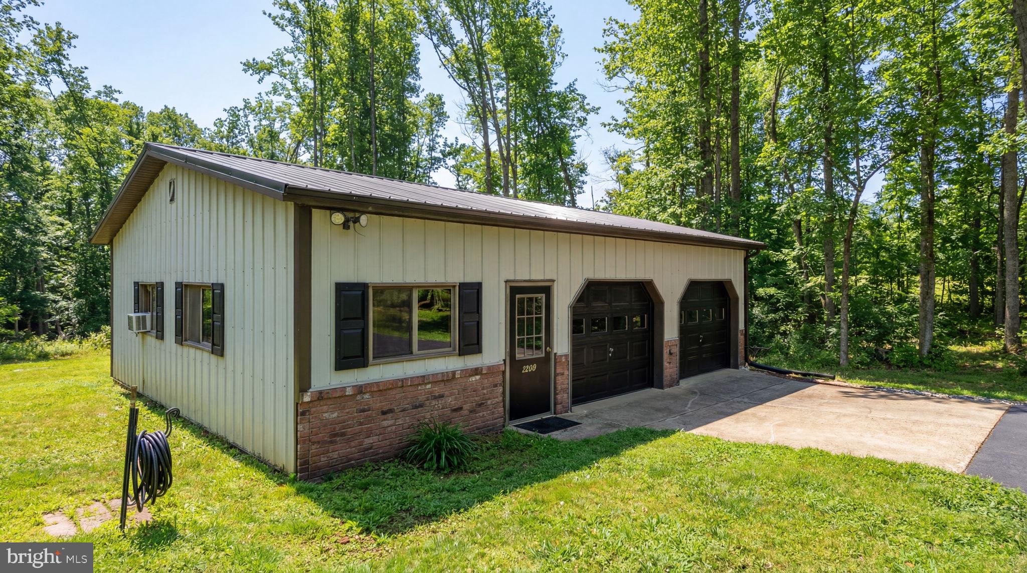 2266 Beaver Dam Road Midland, VA 22728 - Photo 11 of 93 a view of a house with a yard and potted plants